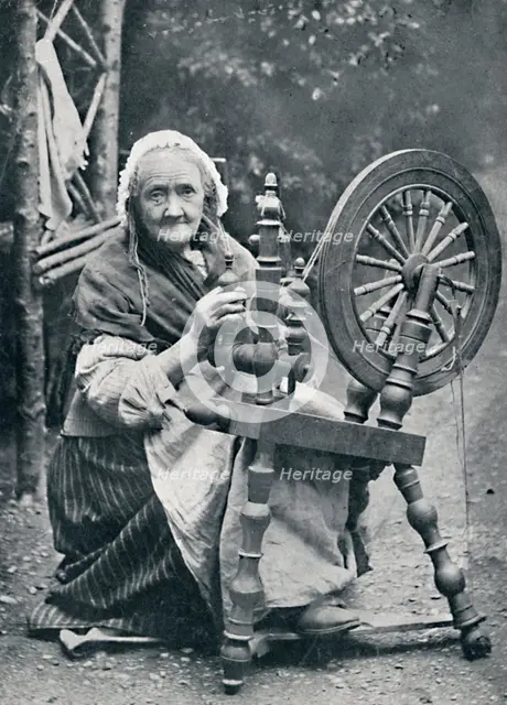 An old Irish woman at her spinning-wheel, 1912. Artist: W Lawrence.