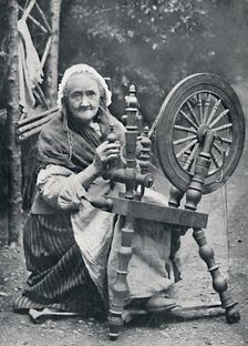 An old Irish woman at her spinning-wheel, 1912. Artist: W Lawrence