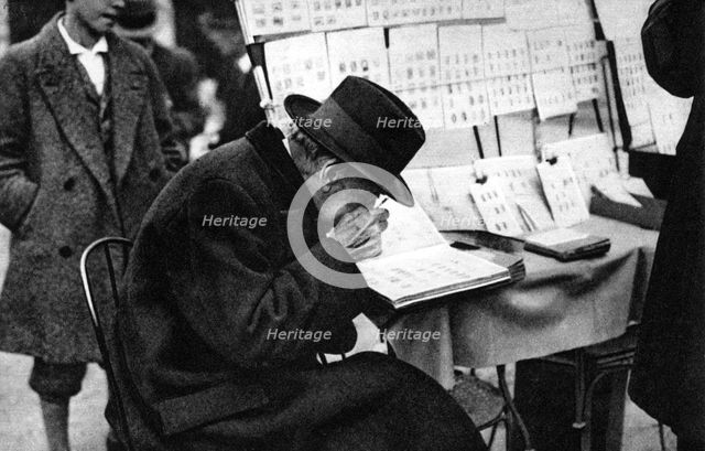 An old purchaser of stamps, Paris, 1931.Artist: Ernest Flammarion
