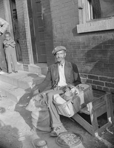 An old peanut vendor on Seaton Road, Washington, D.C., 1942. Creator: Gordon Parks