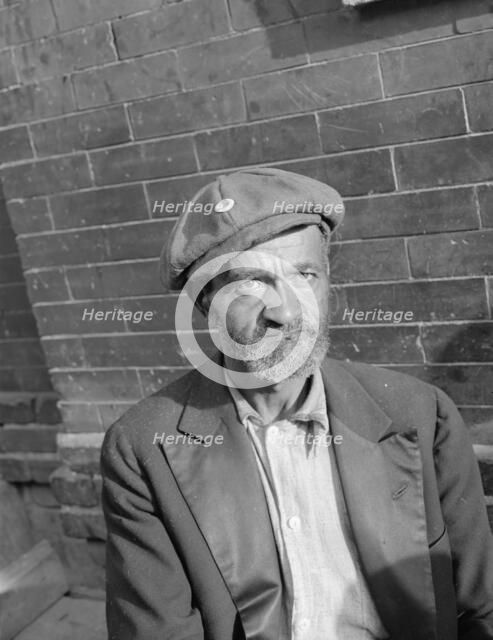 An old peanut vendor on Seaton Road, Washington, D.C., 1942. Creator: Gordon Parks.