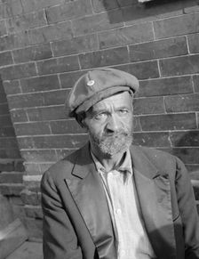 An old peanut vendor on Seaton Road, Washington, D.C., 1942. Creator: Gordon Parks