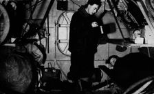 An RAF rigger serving breakfast at 6.30 am, c1940 (1943)