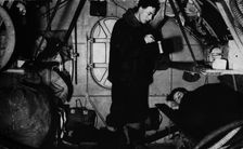 An RAF rigger serving breakfast at 6.30 am, c1940 (1943)