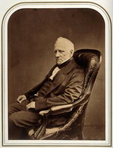 An unidentified man in an armchair. Creator: Maull & Polyblank