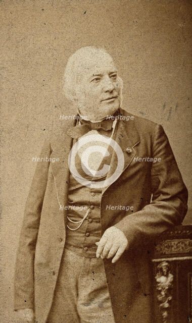 An unidentified man leaning on a cabinet, c1880s. Creator: Frederick Mulnier.