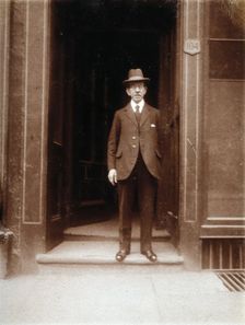 An unidentified man standing in a doorway, 1926. Creator: William Brown