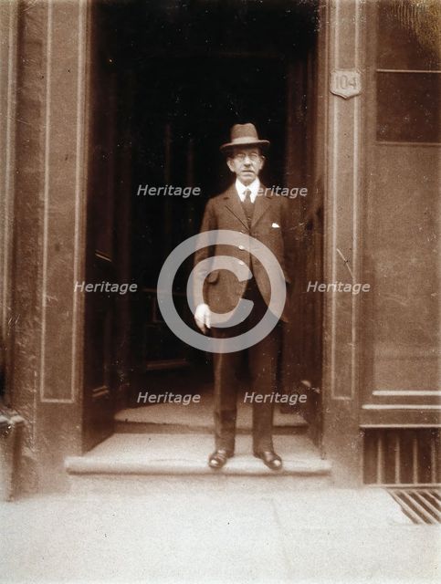 An unidentified man standing in a doorway, 1926. Creator: William Brown.
