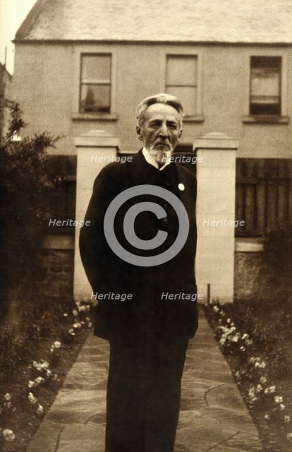 An unidentified man, standing in a garden, c1900. Creator: Unknown.