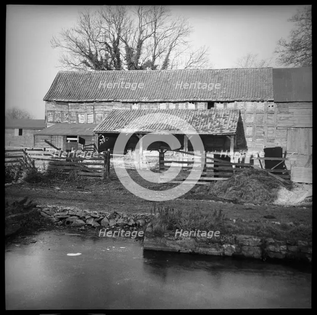 An unidentified timber framed barn with attached cart shed, Herefordshire, 1944. Creator: Marjory L Wight.
