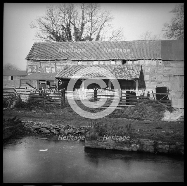 An unidentified timber framed barn with attached cart shed, Herefordshire, 1944. Creator: Marjory L Wight.