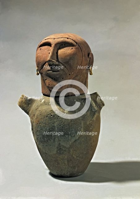 Anthropomorphic funerary urn.
