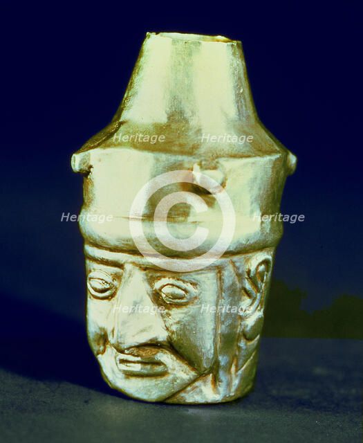 Anthropomorphic head shaped vase, made of silver and representing a hook-nosed person.