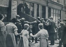 Anti-German rioting in London: A crowd breaking in the windows of a German shop c1914