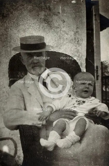 Anton Freiherr von Eiselsberg with a baby. Creator: Unknown.