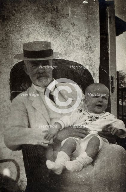Anton Freiherr von Eiselsberg with a baby. Creator: Unknown.