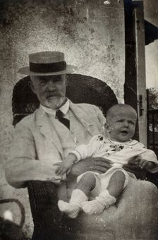 Anton Freiherr von Eiselsberg with a baby. Creator: Unknown