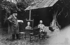 Antoine Lumière painting portrait of posing man, 1905. Creator: Frances Benjamin Johnston