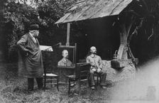 Antoine Lumière painting portrait of posing man, 1905. Creator: Frances Benjamin Johnston