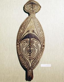 Ancestral Board, wood carved with two human faces