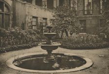 Ancient Mulberry Tree and Fountain in the Garden of Drapers Hall c1935. Creator: Joel
