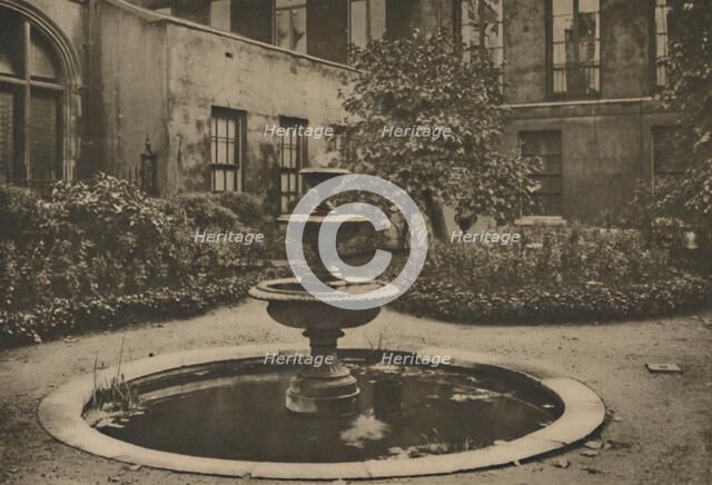 'Ancient Mulberry Tree and Fountain in the Garden of Drapers' Hall', c1935. Creator: Joel.