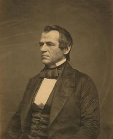 Andrew Johnson, half-length portrait, seated, facing left, 1860. Creator: Jesse Harrison Whitehurst