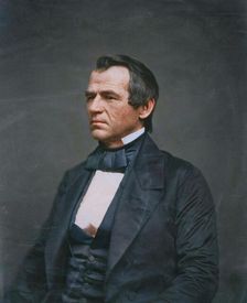 Andrew Johnson, half-length portrait, seated, facing left, 1860. Creator: Jesse Harrison Whitehurst