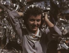 Annette del Sur publicizing salvage campaign...Douglas Aircraft Company, Long Beach, Calif., 1942. Creator: Alfred T Palmer