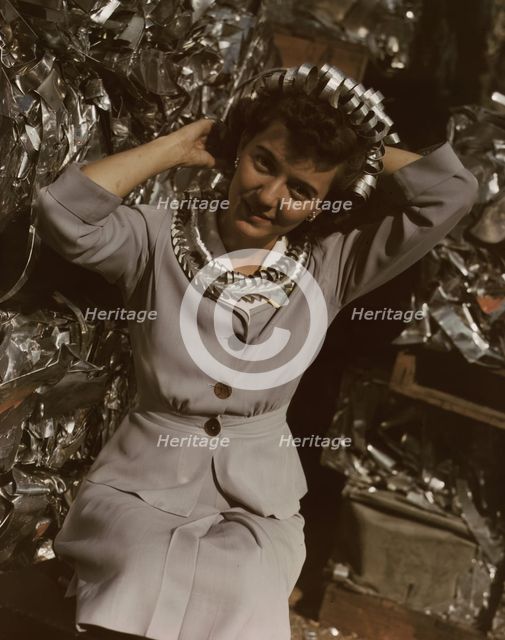 Annette del Sur publicizing salvage campaign...Douglas Aircraft Company, Long Beach, Calif., 1942. Creator: Alfred T Palmer.