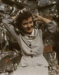 Annette del Sur publicizing salvage campaign...Douglas Aircraft Company, Long Beach, Calif., 1942. Creator: Alfred T Palmer