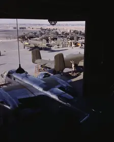Another North American B-25 bomber rolls off the final assembly line to join other ships..., 1942. Creator: Alfred T Palmer