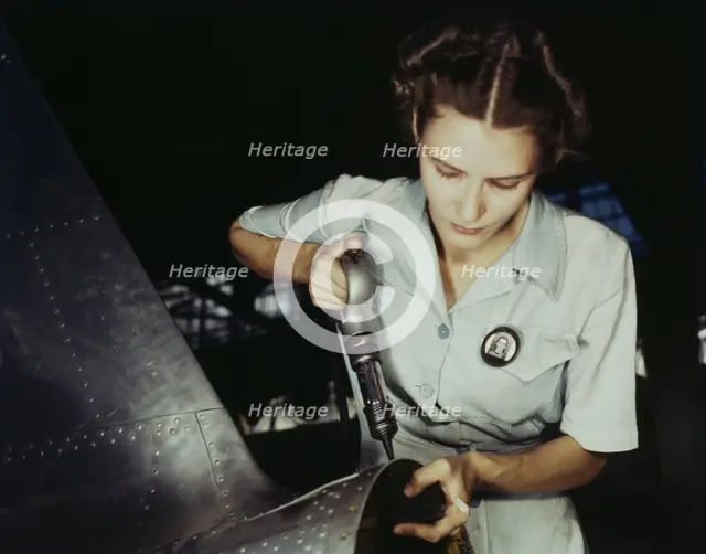 Answering the nation's need for womanpower, Mrs. Virginia Davis made arrangement for the.., 1942. Creator: Howard Hollem.