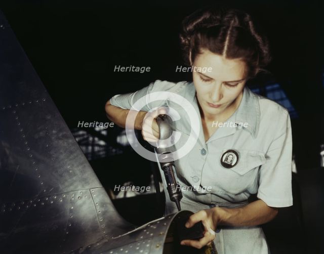 Answering the nation's need for womanpower, Mrs. Virginia Davis made arrangement for the.., 1942. Creator: Howard Hollem.
