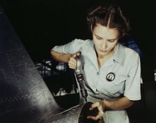 Answering the nation's need for womanpower, Mrs. Virginia Davis made arrangement for the.., 1942. Creator: Howard Hollem