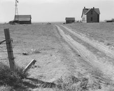 Abandoned farmhouse in Columbia Basin, one mile east of Quincy, Grant County, Washington, 1939. Creator: Dorothea Lange
