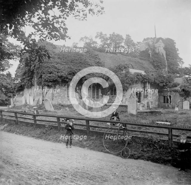 Abandoned stone church and penny-farthing bicycle, 1898. Creator: Robert Augustus Henry L'Estrange.