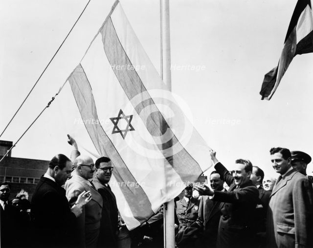 Abba Eban (1915-2002), at the raising of the Israeli flag at UN, 1949. Creator: Unknown.