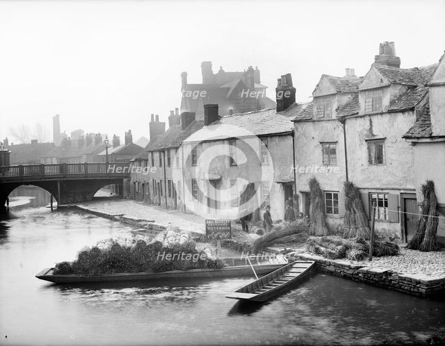 Abel Beesley, Oxford University waterman, and his rush punt, Fisher Row, Oxford, c1860-c1922. Artist: Henry Taunt