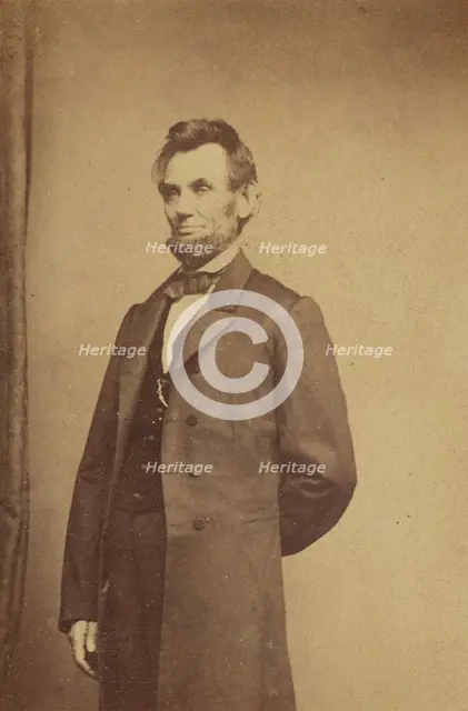 Abraham Lincoln standing with one arm behind his back, about 1864. Creator: Studio of Mathew B. Brady.