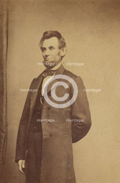 Abraham Lincoln standing with one arm behind his back, about 1864. Creator: Studio of Mathew B. Brady.