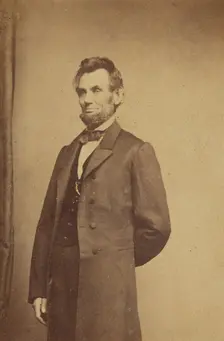 Abraham Lincoln standing with one arm behind his back, about 1864. Creator: Studio of Mathew B. Brady