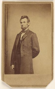 Abraham Lincoln standing with one arm behind his back, about 1864. Creator: Studio of Mathew B. Brady