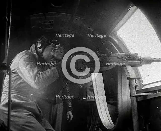 Actor Clark Gable Firing a Machine Gun Out of a Warplane, 1943-1944. Creator: British Pathe Ltd.