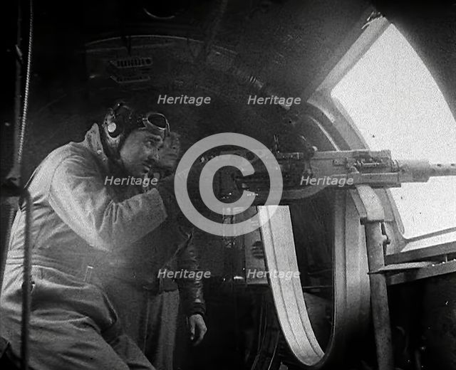 Actor Clark Gable Firing a Machine Gun Out of a Warplane, 1943-1944. Creator: British Pathe Ltd.
