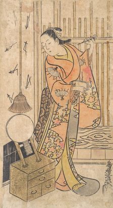 Actor as a Woman Standing by a Mirror Stand, ca. 1735. Creator: Torii Kiyotada