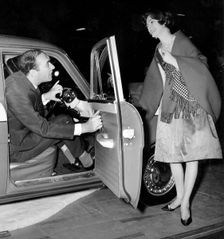 Actor Bernard Bresslaw in Standard Vanguard at 1960 Motor Show. Creator: Unknown