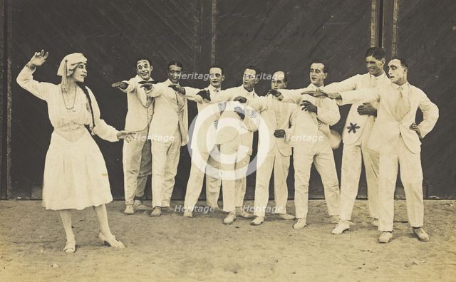 Actors, one in drag, performing on stage as "The Curios",  c1918-1920. Creator: Unknown.
