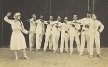 Actors, one in drag, performing on stage as "The Curios", c1918-1920. Creator: Unknown