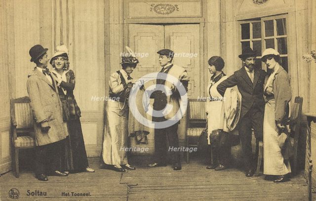 Actors, some in drag, performing at a prisoner of war camp in Belgium, (between 1910 and 1919?). Creator: Unknown.